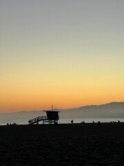 Venice beach - Los Angeles : scene captured at dusk, with a soft gradient in the sky transitioning...