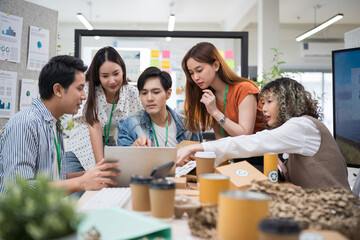 Asian businesspeople in office ESG strategy meeting Implementing environmental protection for a sustainable business model conversation on environmental protection