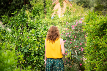 beautiful woman in exotic green garden