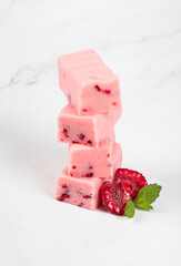 Vegan Raspberry nougat with pieces of freeze-dried raspberries. White background. Close-up