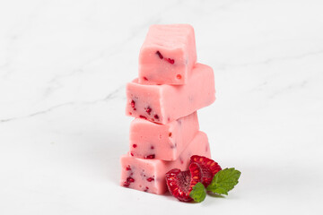 Raspberry candy with pieces of freeze-dried raspberries. Close-up