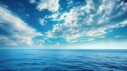 Fototapeta premium Sky with clouds above the ocean: wallpaper seascape background