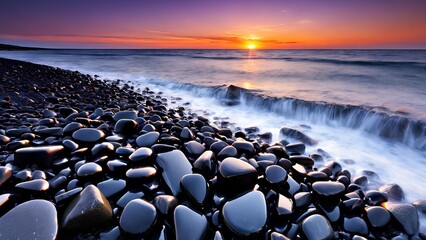 Obraz premium Wallpaper featuring black stones and rocks at sunset, with an empty background.