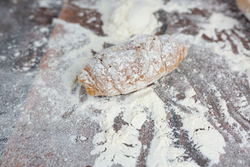 croissant in flour. fresh baked goods