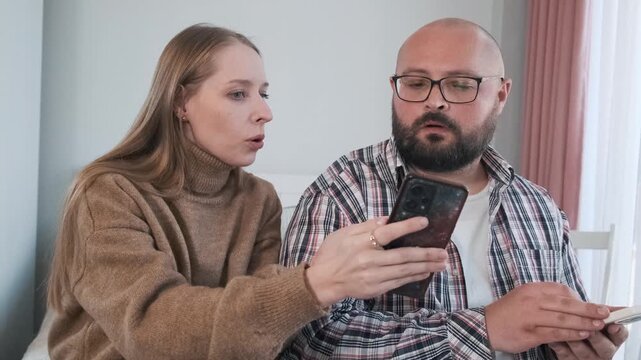 Woman found dirt and compromising evidence about her boyfriend on social media, shows him on her smartphone, and he makes excuses. Wife caught her husband cheating using mobile phone