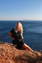 woman sitting on the rocks