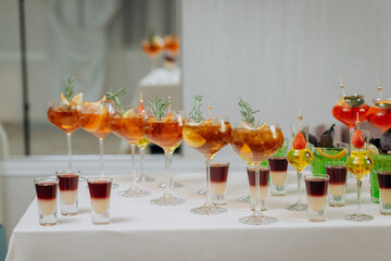 Welcome drink with cocktail glasses and drinks at an event. Alcoholic beverages at a wedding