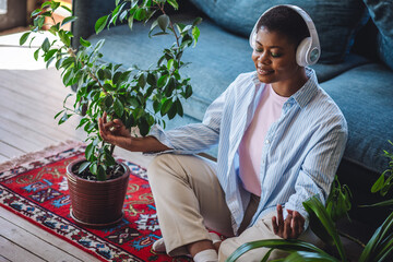 Young African American woman in casual clothing doing home meditation. Relaxation, mental health,...