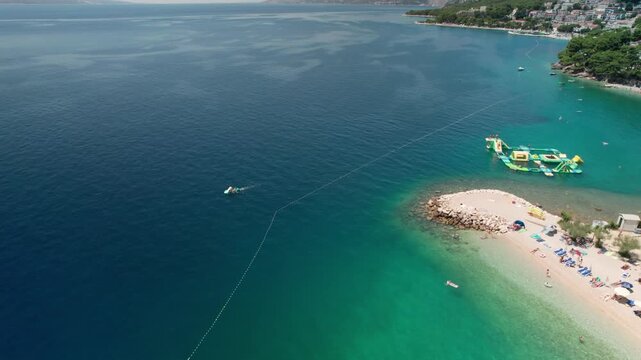 Flying Over Croatian Beach with Jet Ski & Waterpark, Baska Voda, Croatia (Ikovac Beach) 