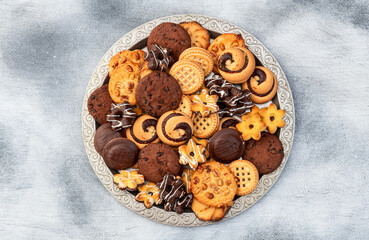 Mix of cookies . Many unhealthy snacks . Top view
