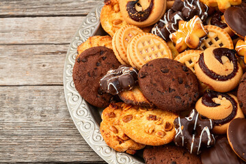 Mix of cookies . Many unhealthy snacks . Top view