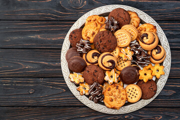 Mix of cookies . Many unhealthy snacks . Top view
