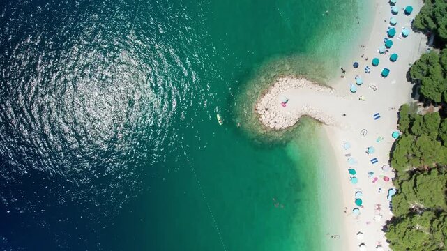 Bird's Eye Reveal of Croatian Beach, Baska Voda, Croatia (Ikovac Beach) 