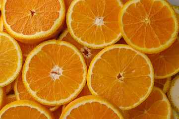 Pattern of slices citrus-fruit of oranges on beige background
