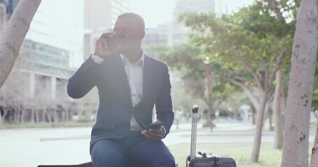 Business travel, commuting and global communication with a professional sending a text on his phone and drinking coffee in the city. Young man waiting outside, reading an email and checking the time