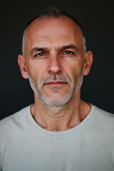 Obraz premium studio portrait of a man in his 40s, front mugshot, looking at the camera, facing the camera straight ahead, random face, random clothes