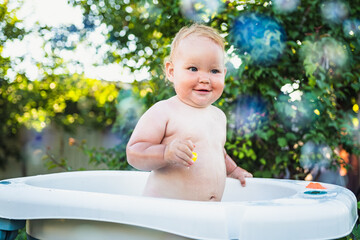 A Baby's Delightful Bubble Bath Adventure in the Summer Sun