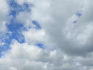 White clouds and blue sky. The view of the clouds and sky is clear and calming

