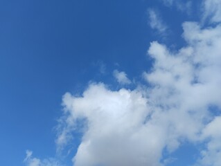 White clouds and blue sky. The view of the clouds and sky is clear and calming
