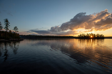 Fototapeta premium Sunset over a lake in Northern Ontario during a canoe trip.