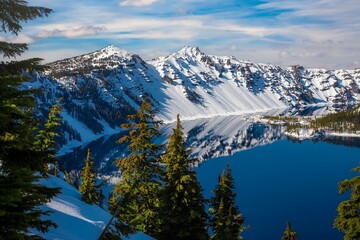 Snow covered rim of Crater Lake in Crater Lake National Park, Oregon.