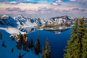 Snow covered rim of Crater Lake and Wizzard Island in Crater Lake National Park, Oregon. © Bob