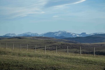 Fototapeta premium Distant mountains with fenced in area