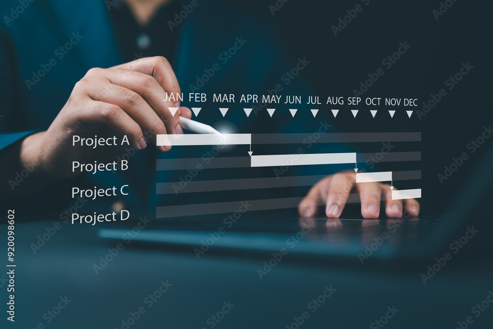 Aufkleber Scheduling and proceeding with task reports, updating or tracking engineering progress. Project engineer or manager uses laptop to manage construction or operation plans with Gantt chart schedules.