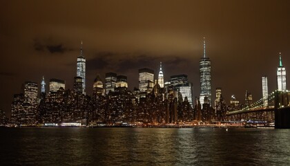 Obraz premium A night view of the Manhattan skyline from across the Hudson River 16