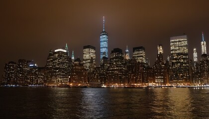 Obraz premium A night view of the Manhattan skyline from across the Hudson River 2