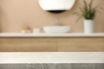 Blurred view of sink and mirror in bathroom