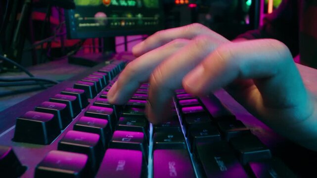 Close up hands man typing keyboard computer pc play game programmer neon cyberspace hacking network competition electronic fingers technology connection social media internet coding chatting texting