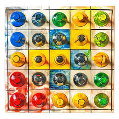 Fototapeta premium Colorful abstract pattern with various shapes and vibrant colors arranged in a grid, creating a playful and dynamic visual.