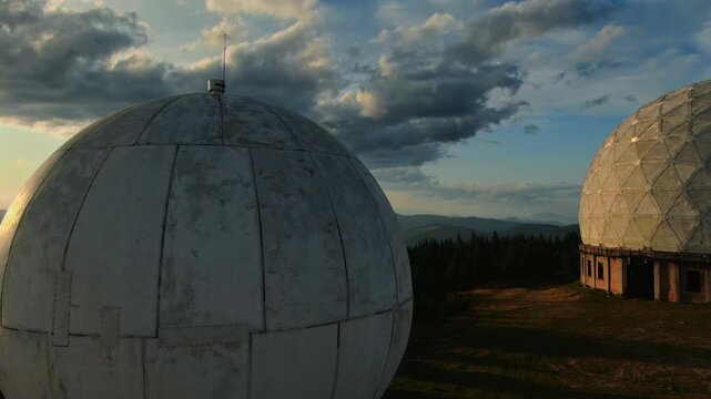 Pamir old military radar station. Aerial view of abandoned secret army site, former radio locating station, Carpathian mountains, Ukraine. Futuristic architecture buildings in forest.