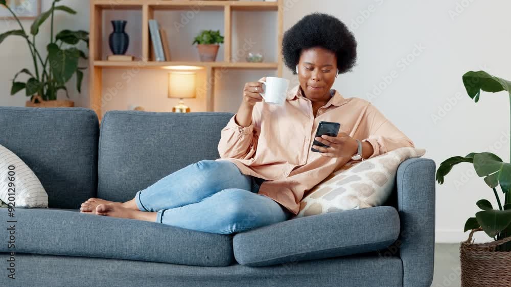 Poster laughing woman listening to music and sending a message with funny memes on her phone and drinking c