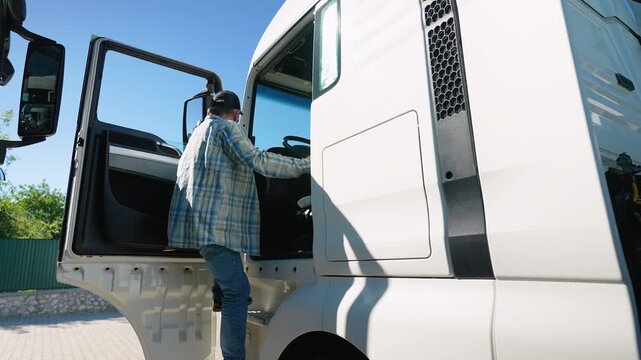 Professional senior truck driver sits in his truck