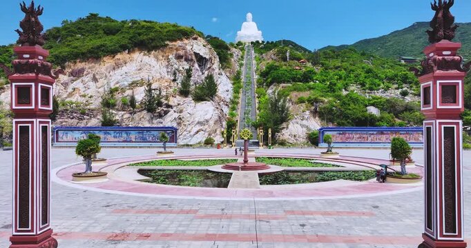 Aerial view of giant Buddha Statue on top of the mountain overlooking the sea Central Vietnam as pray good weather, smooth sea for fishermen fishing easier