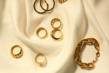 Beautiful jewellery on white fabric background