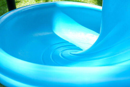clean blue slide in colorful children's playground during the day