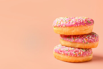 Sweet donuts on pink background