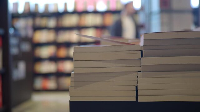 A lot of books are on the shelf in a public library or bookstore