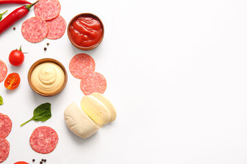 Fresh ingredients for preparing pizza on white background