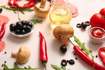 Different ingredients for preparing pizza on light background