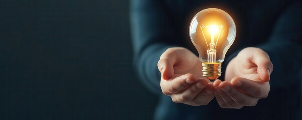 Hands holding lightbulb over marketing plan, innovative ideas and creative solutions in business v2