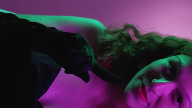 Vertical video. No gesture. Flirty woman. Charming burlesque lady elegant cocktail dress refuse stop admirer waving finger clicking tongue green neon purple gradient.