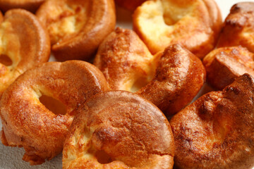 Tasty Yorkshire pudding on table, closeup