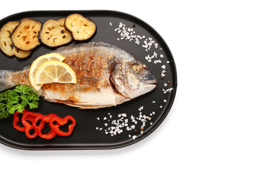 Tray with tasty grilled dorado fish with lemon and vegetables on white background
