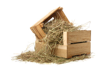 Straw in crates on white background © Pixel-Shot