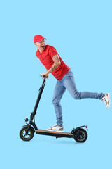 Young courier riding electric scooter on blue background