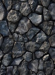 A seamless texture of black lava stone